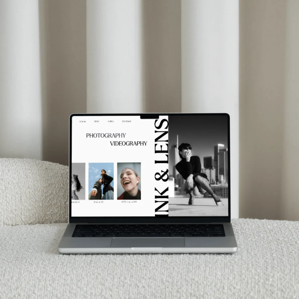 Laptop on neutral coloured furniture with a custom designed concept website on the screen